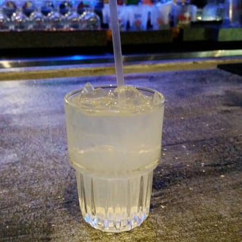 Revolution Lounge - a drink in a glass with a straw - Cocktail Bars Near Me - Wichita, Kansas Revolution Lounge - a drink in a glass with a straw - Cocktail Bars Near Me - Wichita, Kansas