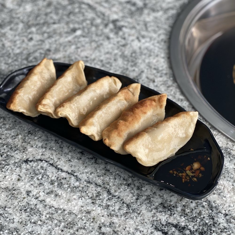 Coco Hot Pot - a plate of food on a counter - Chinese Near Me - Columbus, Ohio Coco Hot Pot - a plate of food on a counter - Chinese Near Me - Columbus, Ohio
