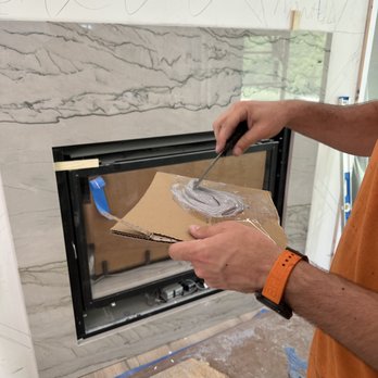 TTS Granite - a man painting a fireplace - General Contractors Near Me - Steger, Illinois TTS Granite - a man painting a fireplace - General Contractors Near Me - Steger, Illinois