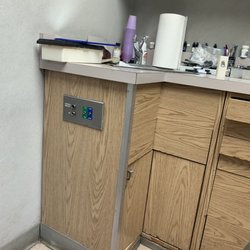 Sanitary health hazard!! That outlet is placed backwards, cabinets outdated and filthy.
