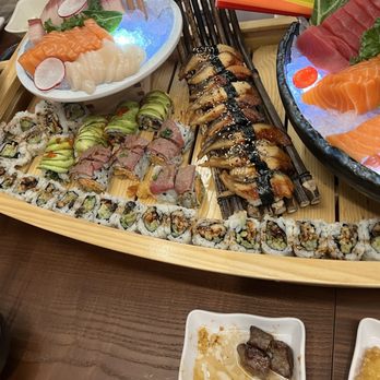 Sushi Island - Sushi boat with sashimi and sushi: Eel, Salmon, Escobar, Tuna - Japanese Near Me - Winter Park, Florida Sushi Island - Sushi boat with sashimi and sushi: Eel, Salmon, Escobar, Tuna - Japanese Near Me - Winter Park, Florida