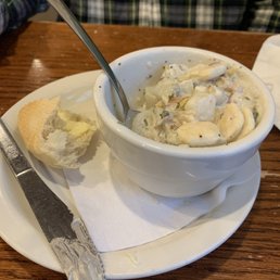 a bowl of soup and a bagel a bowl of soup and a bagel
