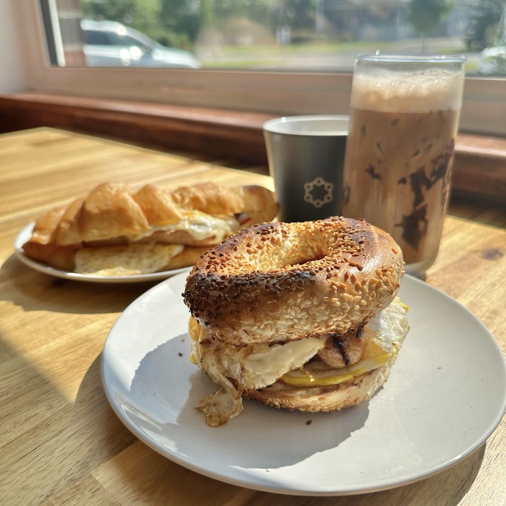 BBCR Cafe - Front: Double Egger Breakfast Sandwich - Montreal Bagel and Sausage ($7) - Coffee & Tea Near Me - Ottawa, Ontario BBCR Cafe - Front: Double Egger Breakfast Sandwich - Montreal Bagel and Sausage ($7) - Coffee & Tea Near Me - Ottawa, Ontario