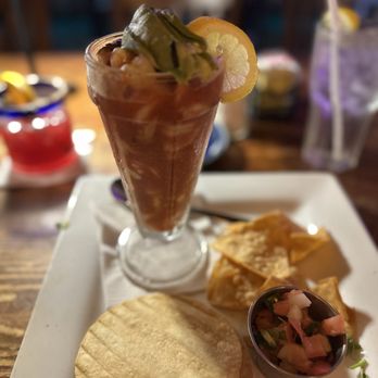 Doneraki - Katy - Vuelve a la Vida cocktail with a side of spicy pico de gallo tostadas and chips made in house fresh - Mexican Near Me - Katy, Texas Doneraki - Katy - Vuelve a la Vida cocktail with a side of spicy pico de gallo tostadas and chips made in house fresh - Mexican Near Me - Katy, Texas