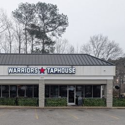 Exterior outside entrance of Warriors Taphouse - This is a view of the storefront for the restaurant. Photo taken January 21, 2025. - Virginia Beach, Virginia Exterior outside entrance of Warriors Taphouse - This is a view of the storefront for the restaurant. Photo taken January 21, 2025. - Virginia Beach, Virginia