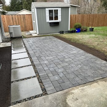 DVO Landscaping - a backyard patio with pavers and a fire pit - Landscaping Near Me DVO Landscaping - a backyard patio with pavers and a fire pit - Landscaping Near Me