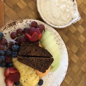 Salt & Ivy, A Coastal Kitchen - Fruit platter and grits - New American Near Me - Biloxi, Mississippi Salt & Ivy, A Coastal Kitchen - Fruit platter and grits - New American Near Me - Biloxi, Mississippi