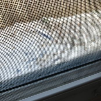 Your Home Improvement - a close up of a window screen - General Contractors Near Me