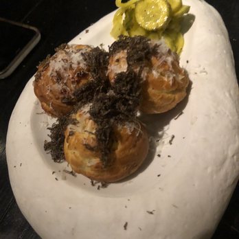Stubborn Seed - Cacio e Pepe Cheesy Puffs with shaved truffle - New American Near Me - Miami Beach, Florida Stubborn Seed - Cacio e Pepe Cheesy Puffs with shaved truffle - New American Near Me - Miami Beach, Florida
