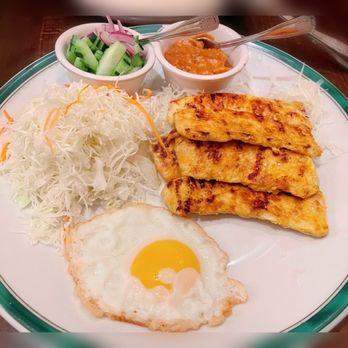 Nakorn Thai SF - My customized meal - Chicken Satay that comes with cucumber salad and peanut sauce; fried egg; side of cabbage. Yumm - Thai Near Me - San Francisco, California Nakorn Thai SF - My customized meal - Chicken Satay that comes with cucumber salad and peanut sauce; fried egg; side of cabbage. Yumm - Thai Near Me - San Francisco, California