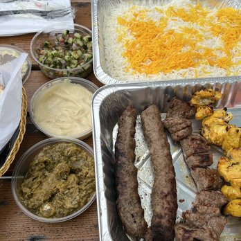 Maman Joon Kitchen Tysons - Family platter for 2-3 people with ground beef, prime beef, and chicken. Sides are cucumber salad, hummus, and eggplant purée. - Persian/Iranian Near Me - Tysons, Virginia