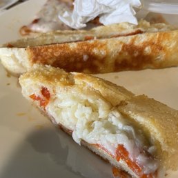 two pieces of pizza on a plate two pieces of pizza on a plate
