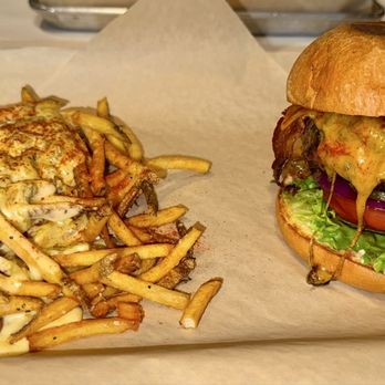 High Point Grill - A cheeseburger with lettuce, tomato, pickles, and bacon on a bun, accompanied by French fries topped with melted cheese and seasoning. - Sandwiches Near Me - Albuquerque, New Mexico