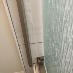 This was supposed to be screwed in. They just glued it and threw away the screws that came with the hardware kit. They did this twice. This was supposed to be screwed in. They just glued it and threw away the screws that came with the hardware kit. They did this twice.