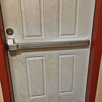 Little Flowers - Door to outside play area 8/2019. That is dirt and grime, and the push bar on the door is sticky with grime; you really have to push it. - Child Care & Day Care Near Me - Lacey, Washington Little Flowers - Door to outside play area 8/2019. That is dirt and grime, and the push bar on the door is sticky with grime; you really have to push it. - Child Care & Day Care Near Me - Lacey, Washington