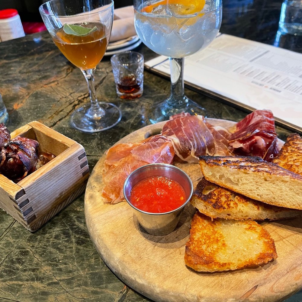 Ultreia - Pan con Tomate with Jamon Serrano and Bacon wrapped dates - Tapas Bars Near Me - Denver, Colorado Ultreia - Pan con Tomate with Jamon Serrano and Bacon wrapped dates - Tapas Bars Near Me - Denver, Colorado