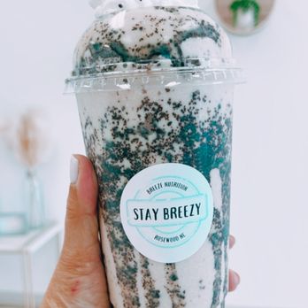 Breeze Nutrition - a hand holding a cup of iced coffee - Juice Bars & Smoothies Near Me - Goldsboro, North Carolina Breeze Nutrition - a hand holding a cup of iced coffee - Juice Bars & Smoothies Near Me - Goldsboro, North Carolina