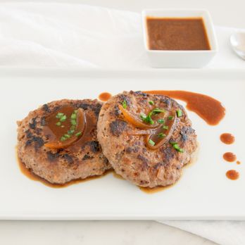 Annie's Table - two meat patties on a white plate - Korean Near Me - Irvine, California Annie's Table - two meat patties on a white plate - Korean Near Me - Irvine, California