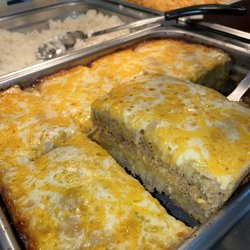 Layered sweet plantains, ground meat, and cheese
