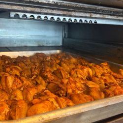 We don't rush our wings.
They're cooked low and steady in the oven, then fried for a crispy finish that keeps them juicy inside. It's extra