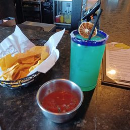 Cielo margarita with chips and salsa at large bar
