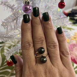Christmas nails dark green with gold and blue sparkle glitter.