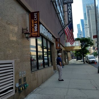 Broadway Deli & Bagels - a man walking down the sidewalk - Delis Near Me - New York, New York Broadway Deli & Bagels - a man walking down the sidewalk - Delis Near Me - New York, New York