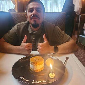 Harris' Restaurant - Birthday boy with his carrot cake lol - Steakhouses Near Me - San Francisco, California