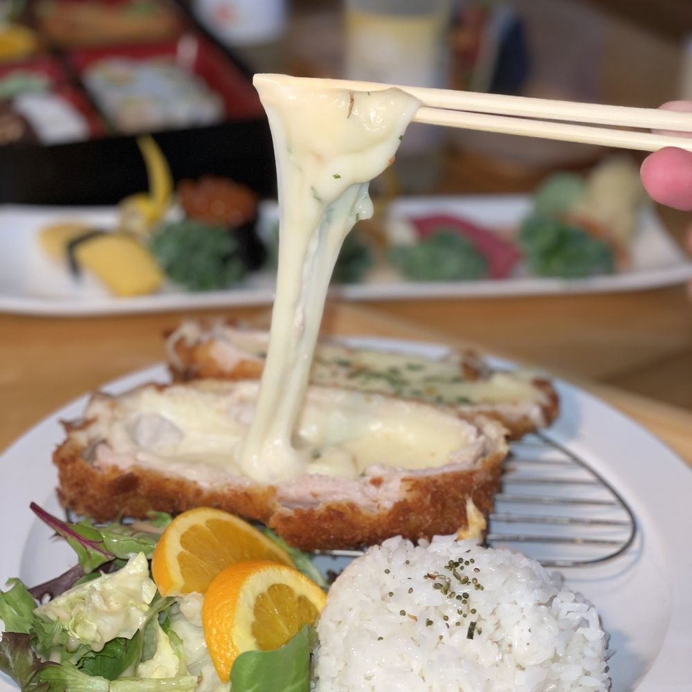 Kiori kitchen - a person dipping cheese over a plate of food - Japanese Near Me - Morris Plains, New Jersey Kiori kitchen - a person dipping cheese over a plate of food - Japanese Near Me - Morris Plains, New Jersey