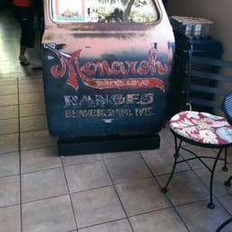 The hostess stand is a old truck door.