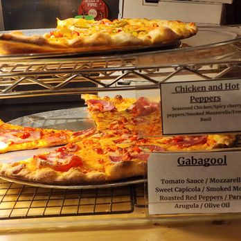 Uptown Slice - a variety of pizzas on display - Pizza Near Me - Sheboygan, Wisconsin Uptown Slice - a variety of pizzas on display - Pizza Near Me - Sheboygan, Wisconsin