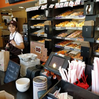 Dunkin' - a woman behind a counter in a donut shop - Donuts Near Me - Whitestone, New York Dunkin' - a woman behind a counter in a donut shop - Donuts Near Me - Whitestone, New York