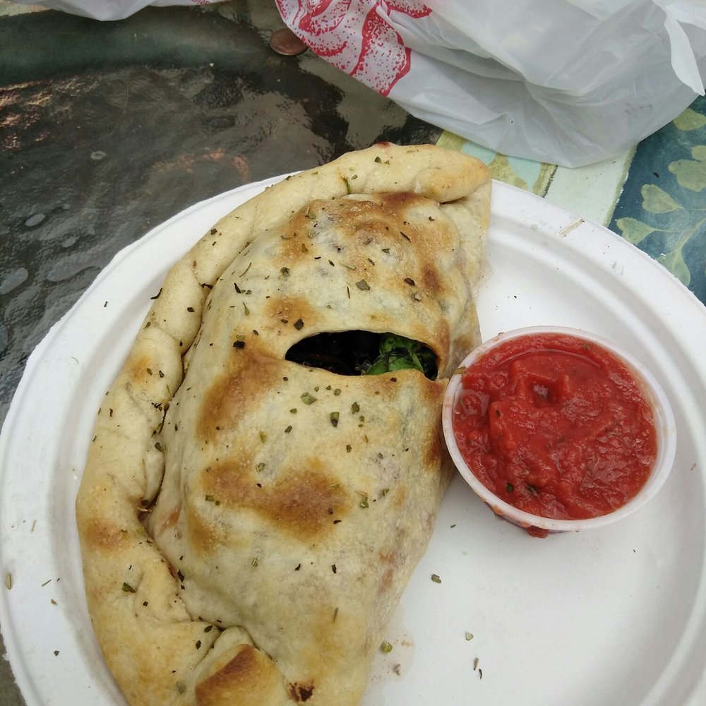 Noble Pie Parlor - Midtown - Calzone with kalamata olives, mushrooms and some spinach - Chicken Wings Near Me - Reno, Nevada