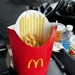 McDonald's - This is a large fry. I asked to get it filled they said their policy is 12oz. This is a small fry in a large container
