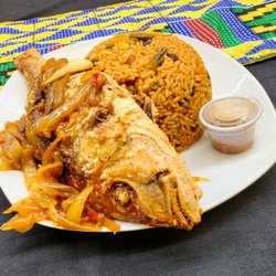 Fatu’s Kitchen - Fried fish with saucy peppers on the side. Crispy on the outside, tender and flavorful on the inside. Rice with chicken, sausage, beans.