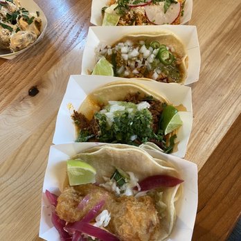 Centro - Selection of 4 different tacos. From top to bottom Chicken Tinga, Papas con chorizo, Barbacoa, Pescado - Cocktail Bars Near Me - Minneapolis, Minnesota