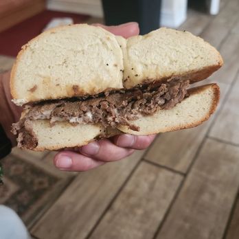 Avalon Coffee - Cape May - a hand holding a sandwich - Coffee & Tea Near Me - Cape May, New Jersey