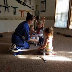 Gilbert's Martial Arts Academy - One "Excellent Kid" is very eager to get his belt. :)