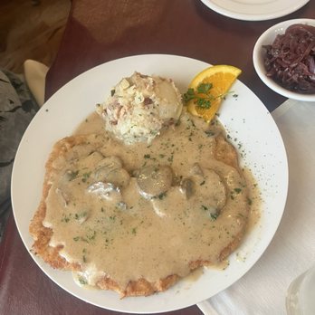 Alpine Haus Restaurant - Jager Schnitzel with Potato Salad - German Near Me - New Braunfels, Texas Alpine Haus Restaurant - Jager Schnitzel with Potato Salad - German Near Me - New Braunfels, Texas