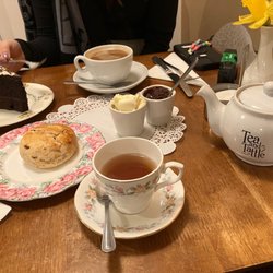 Tea and Tattle - Earl grey tea, fruit scone with strawberry&black pepper jam, and clotted cream. Coffee and chocolate cake.