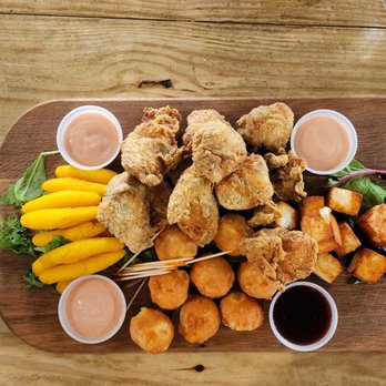 Cayo Azul - Starter platter, from left to right, sorullitos, cheeseballs and fish fritters in the middle, fried white cheese and guava sauce - Seafood Near Me - Cabo Rojo, Puerto Rico Cayo Azul - Starter platter, from left to right, sorullitos, cheeseballs and fish fritters in the middle, fried white cheese and guava sauce - Seafood Near Me - Cabo Rojo, Puerto Rico