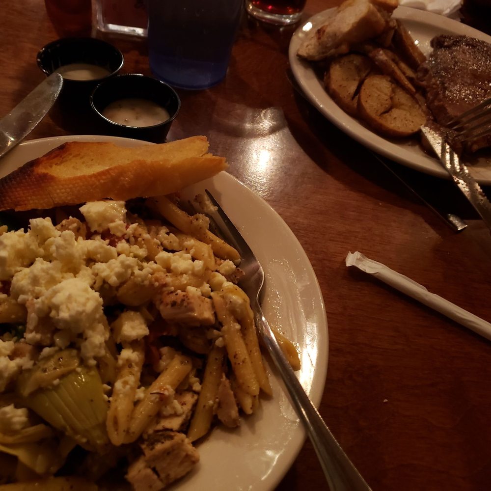 Penne pasts with grilled chicken and very tender ribeye steak and fried potatoes Penne pasts with grilled chicken and very tender ribeye steak and fried potatoes