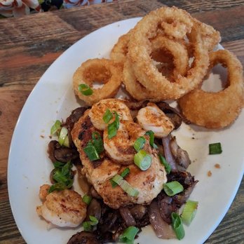 Ruby Tuesday - Ruby Tuesday French Quarter chicken and grilled shrimp with onion rings. Very flavorful meal. Upper level onion rings. - American Near Me - Las Cruces, New Mexico