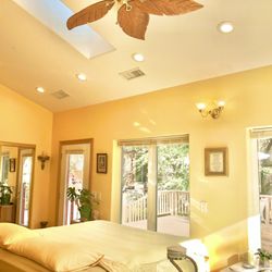 Heaven on Earth Retreat - But a few of the walls of verdant canyon view windows in the elegant and cheerful Spectacular Suite bedroom.