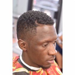 The Cutting Edge Barbershop - Well blended fade with a nice shape up!