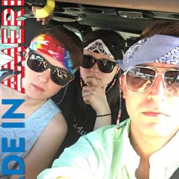 a group of people in a car a group of people in a car