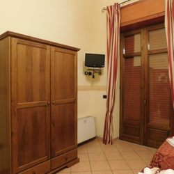 Masseria Feudo - Masseria Feudo September 2016 Tiny TV and the wardrobe.  Closed window.  In bedroom