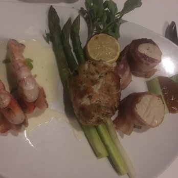 Morton's The Steakhouse - Mix Grill lump crab cake, 2 grilled shrimp, and 2 bacon wrapped scallops - Steakhouses Near Me - Honolulu, Hawaii Morton's The Steakhouse - Mix Grill lump crab cake, 2 grilled shrimp, and 2 bacon wrapped scallops - Steakhouses Near Me - Honolulu, Hawaii
