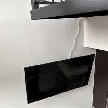 TV Geeks - View of TV coming down, spiral staircase from bedroom - TV Mounting Near Me