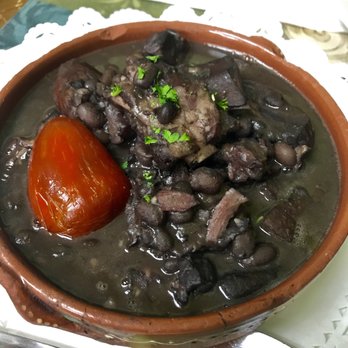 Sabor Unido - Close up of the bean stew. There were pig ears, ribs and sausages in it. Very delicious. - Portuguese Near Me - Newark, New Jersey Sabor Unido - Close up of the bean stew. There were pig ears, ribs and sausages in it. Very delicious. - Portuguese Near Me - Newark, New Jersey